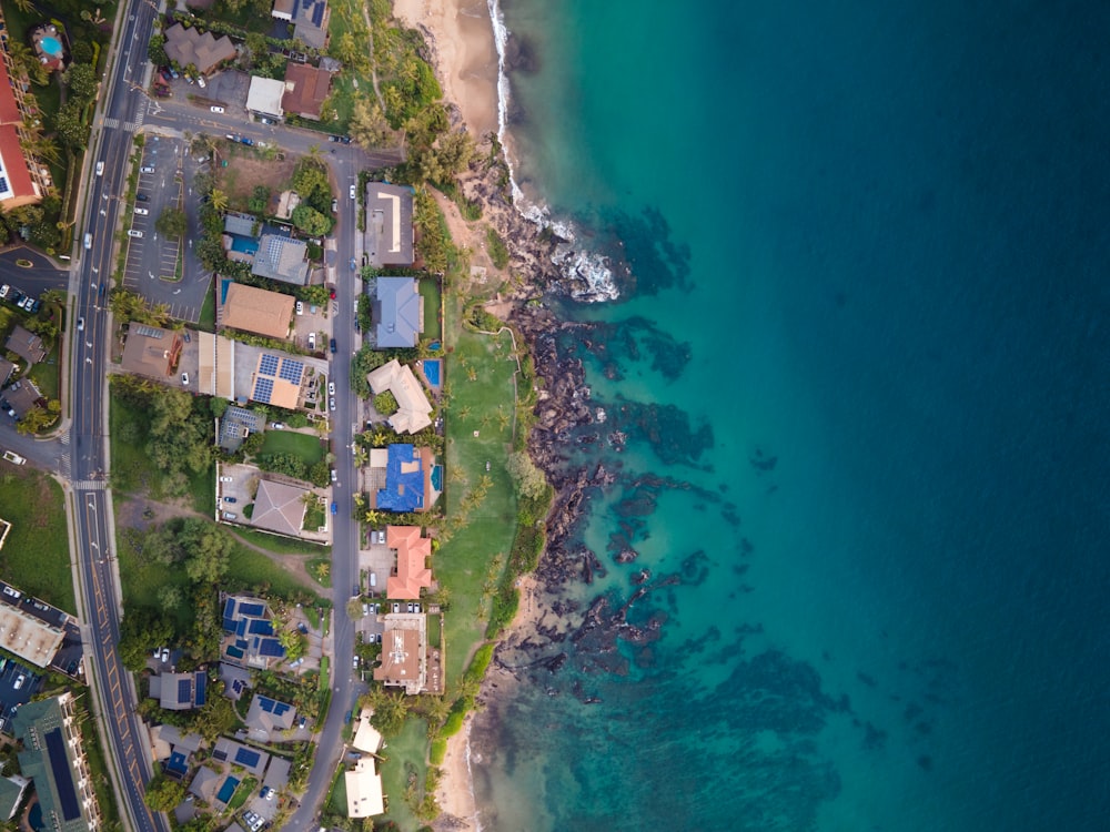 a bird's eye view of a beach and houses