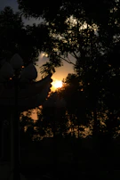 Sunset casting golden light over a Shaktimitra project site in the hills.