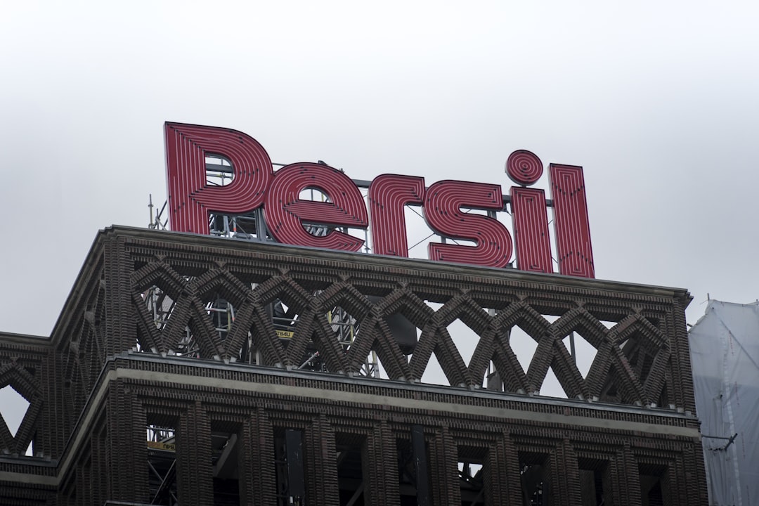 a large red sign on top of a building,