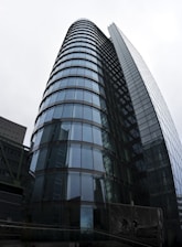 Modern commercial building featuring a sleek glass curtain wall system.