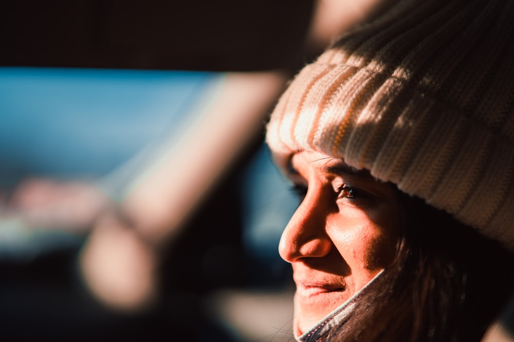 a close up of a person wearing a hat