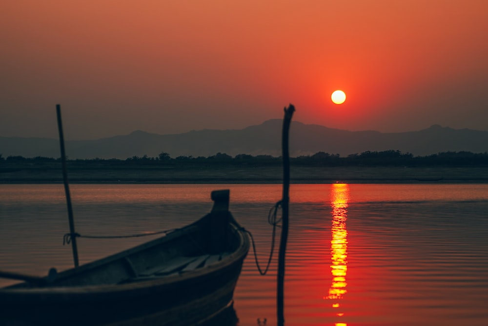 a boat sitting on top of a body of water