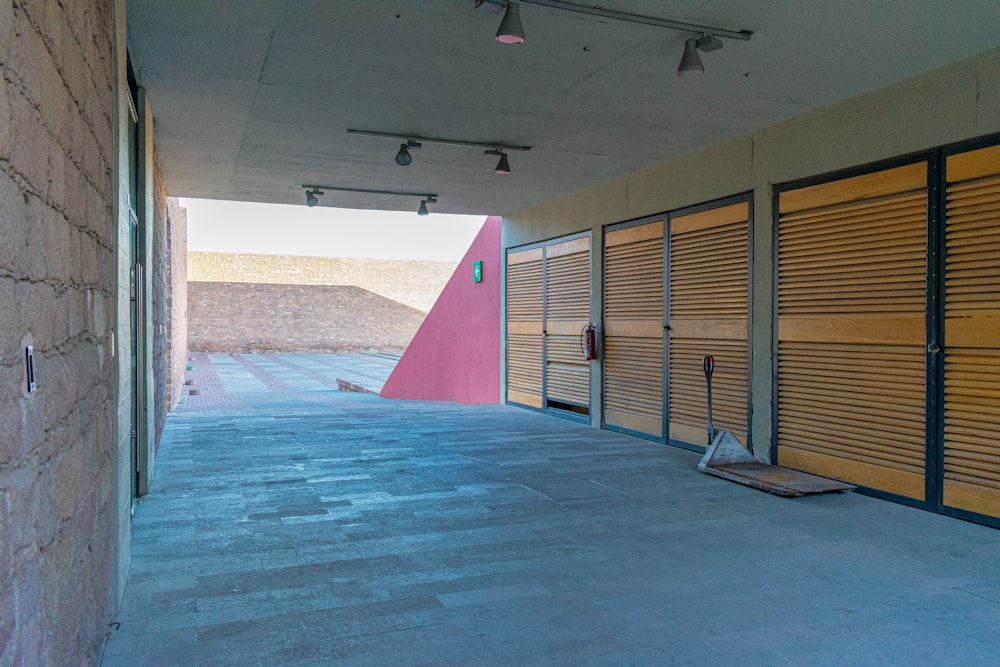 an empty parking garage with closed doors on both sides