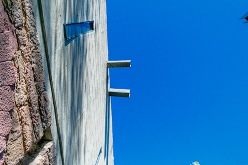 Exterior view of a commercial building after a fresh paint and plastering job.