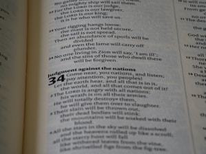 A close-up view of a page from a book, displaying text in a column format. The text is printed in black on a white page, with numbers and sections bolded for emphasis.
