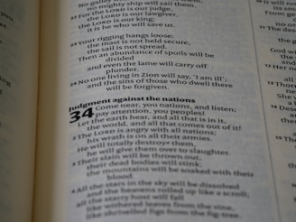 A close-up view of a page from a book, displaying text in a column format. The text is printed in black on a white page, with numbers and sections bolded for emphasis.