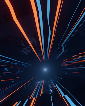 A digital abstract landscape featuring dynamic lines shooting towards a bright, central vanishing point. The lines are primarily in bright orange and blue set against a dark, shadowy background, giving a sense of rapid motion and depth.