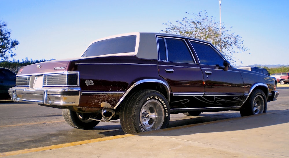 a purple truck parked in a parking lot