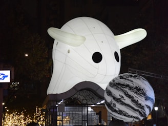 Nighttime shot of an illuminated inflatable structure at a brand activation