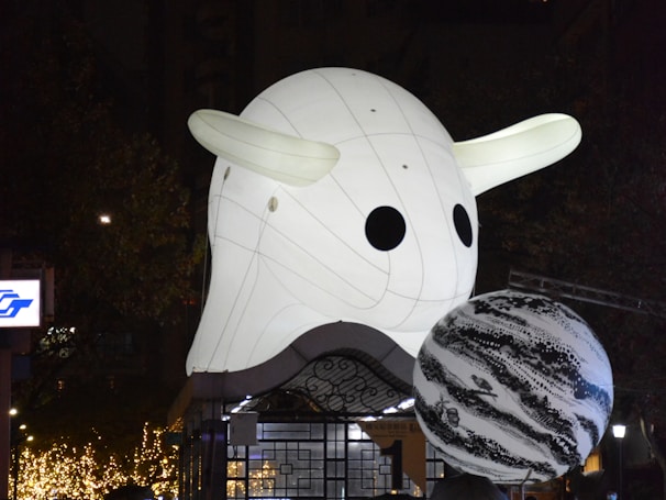 Nighttime shot of an illuminated inflatable structure at a brand activation