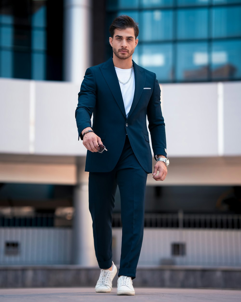 a man in a suit walking down the street