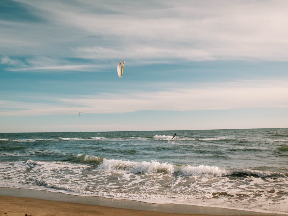 a person para sailing in the ocean on a sunny day