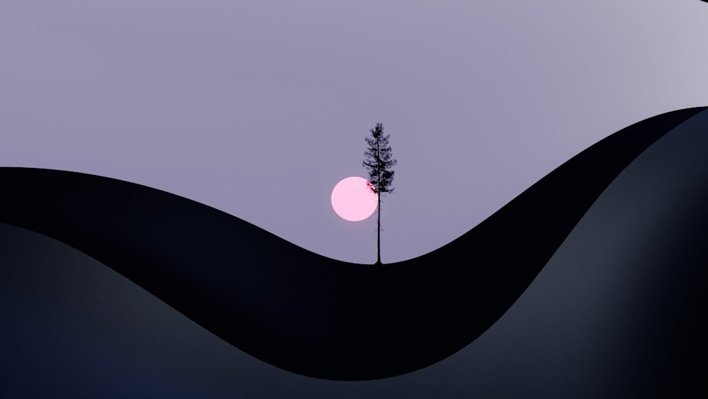 a lone tree in the middle of a landscape