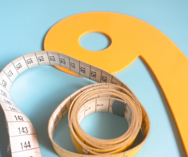 a measuring tape and a tape measure on a blue background