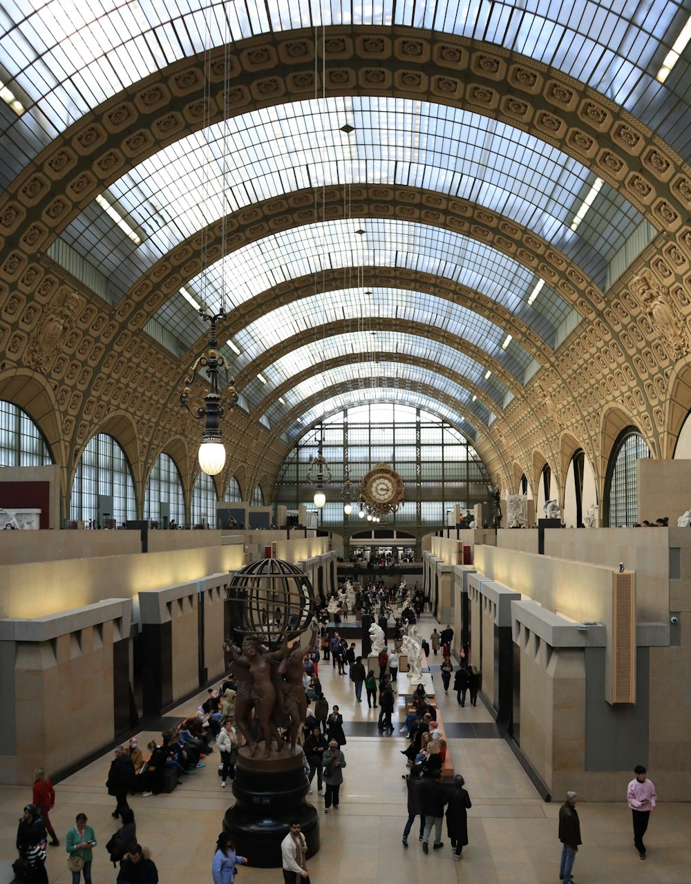 a group of people walking around a train station