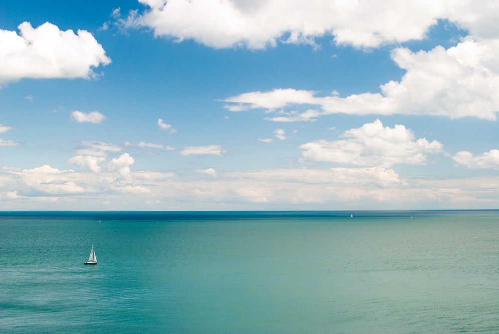 a sailboat in the middle of a large body of water