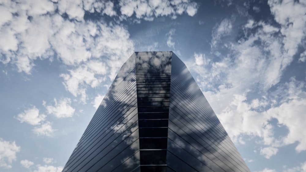 a very tall building with a sky background