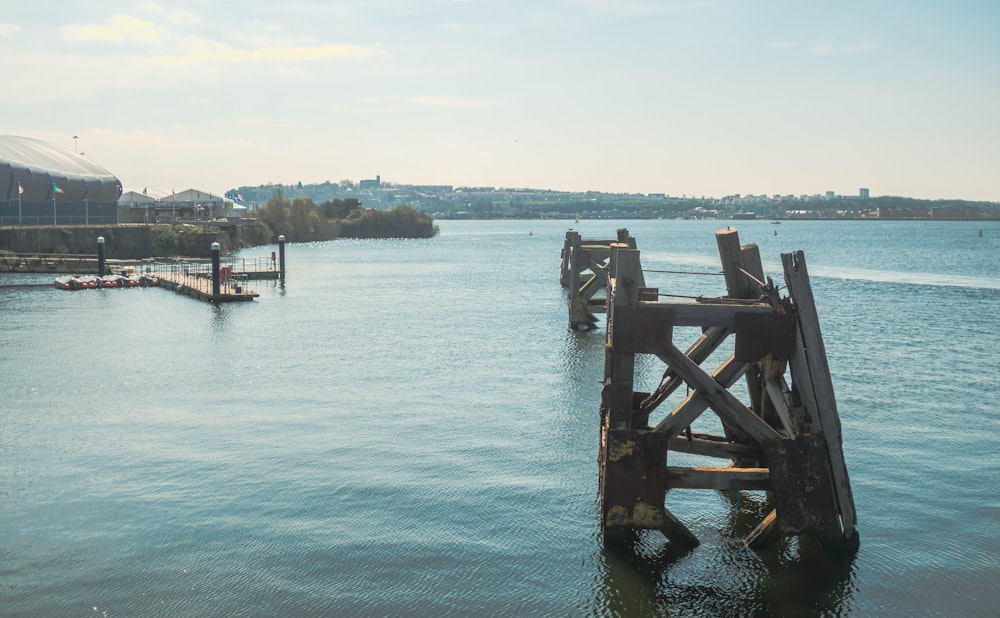 a large body of water with a wooden structure in the middle of it