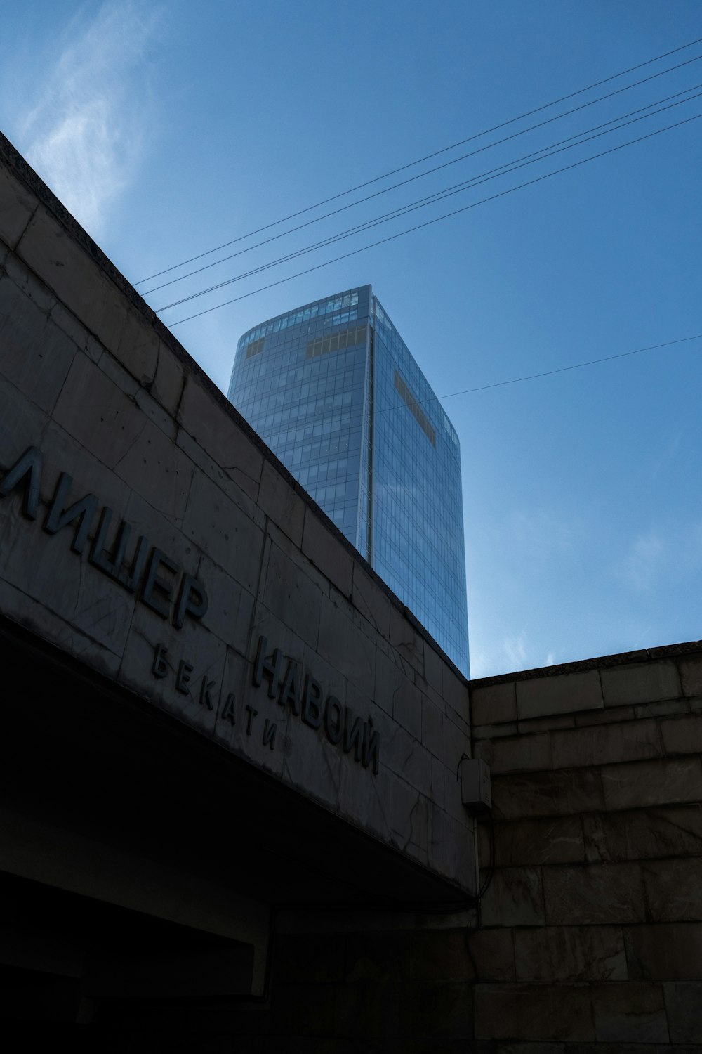 a tall building sitting next to a brick wall