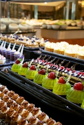 a variety of desserts on display in a buffet