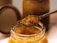 A satisfied customer enjoying a jar of authentic Nepali achar.