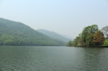 A serene lake surrounded by untouched natural landscape.