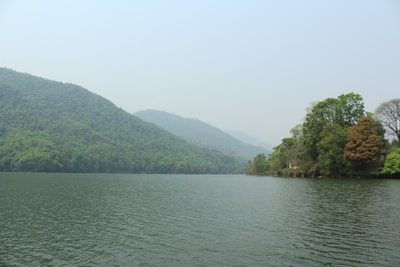 A serene lake surrounded by untouched natural landscape.