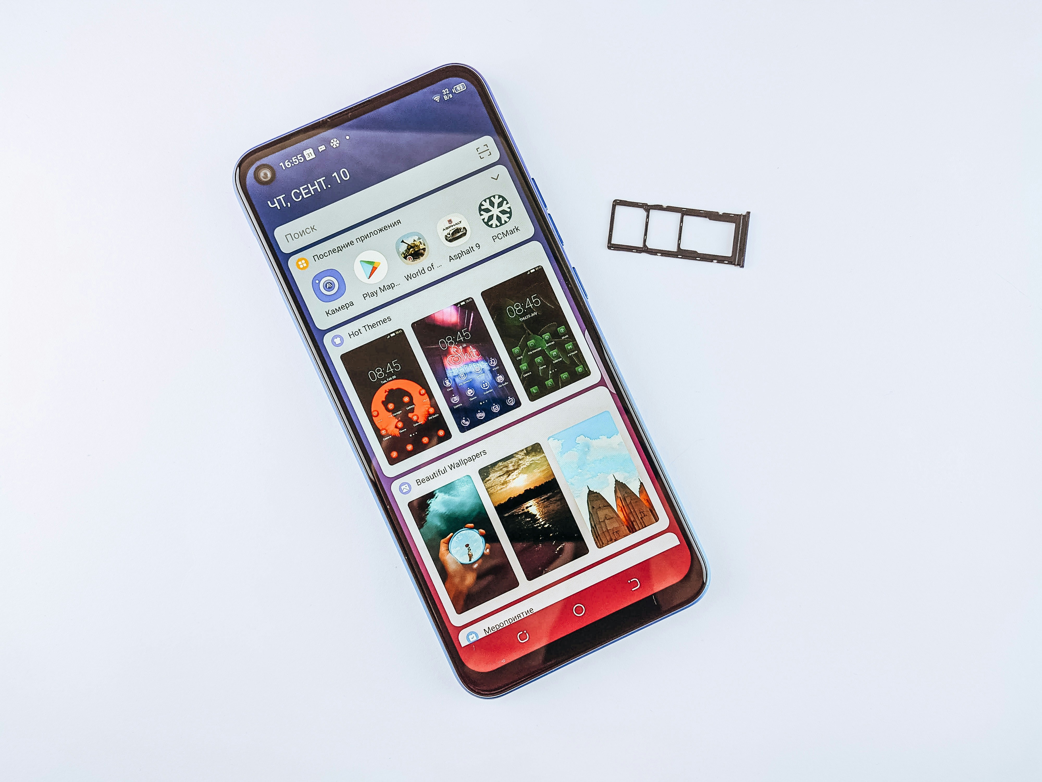 a cell phone sitting on top of a white table, 