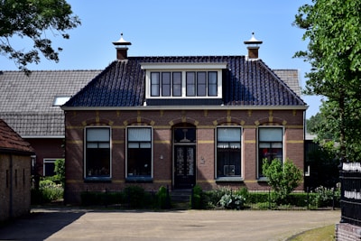 Close-up of a newly installed traditional-style plastic conservatory roof blending seamlessly with a brick home.