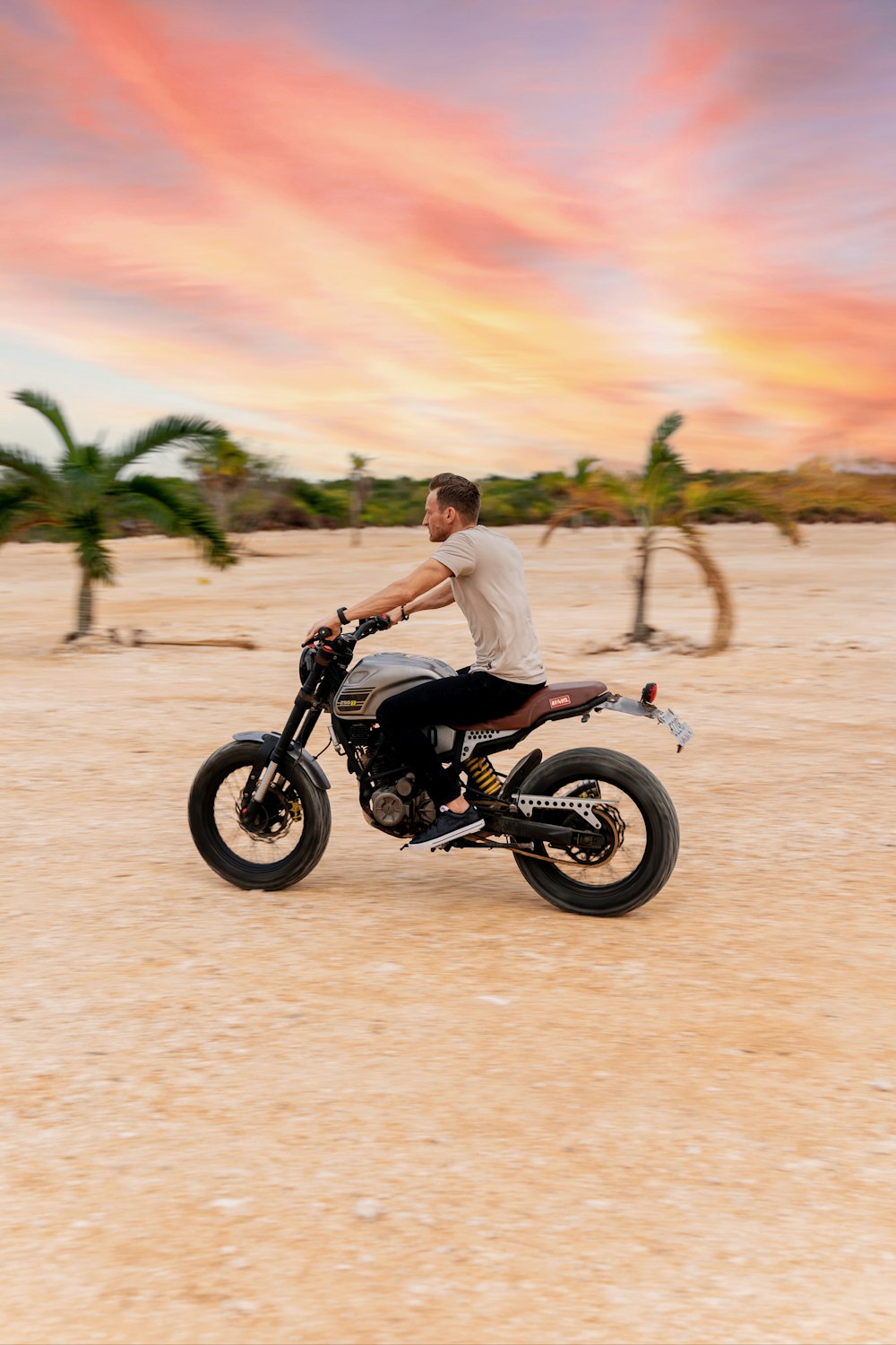 a man riding on the back of a motorcycle