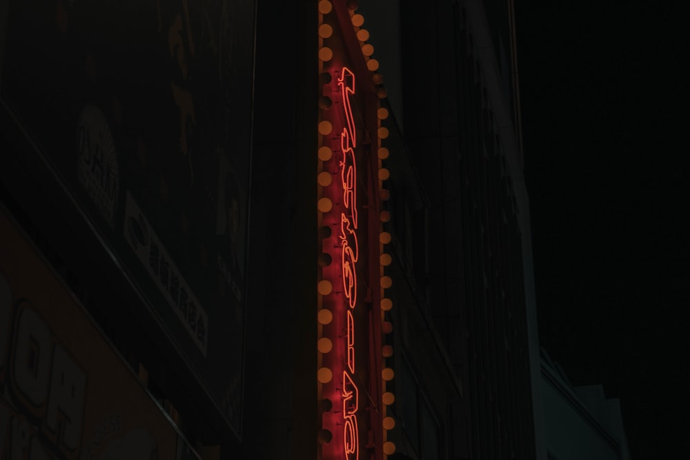 a neon sign on the side of a building