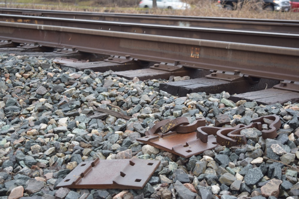 a close up of a train track with rocks on it