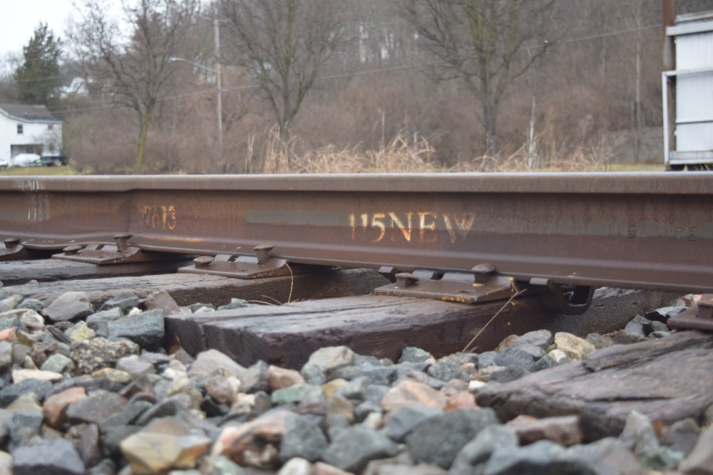 a close up of a train track with graffiti on it
