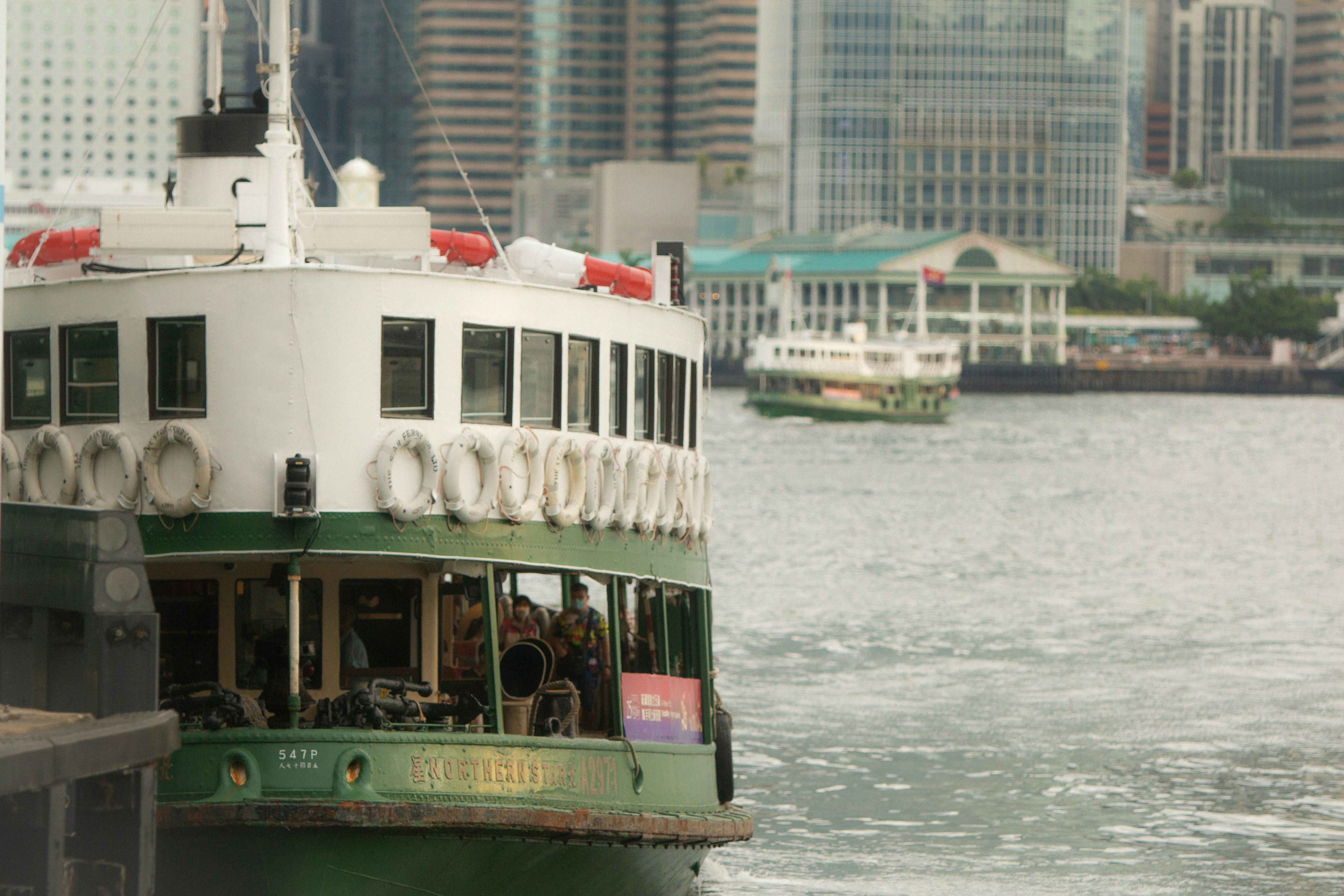 a large boat floating on top of a body of water, 