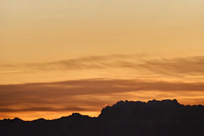 Sunset view over the Andes mountains seen from a high-altitude trail during a Kraken Tours Bolivia adventure.