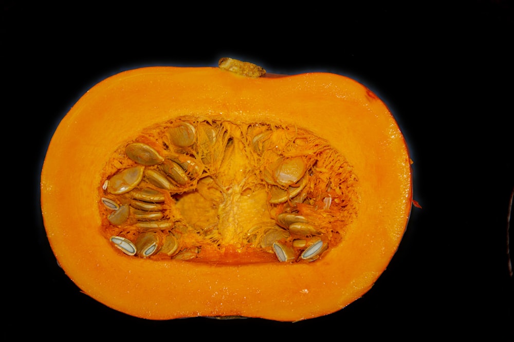 a close up of a pumpkin cut in half