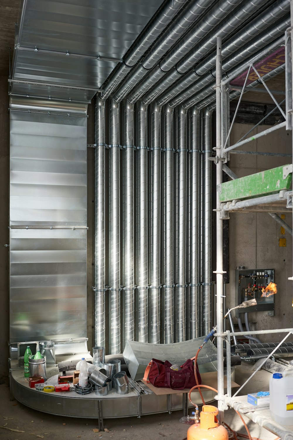 a room filled with lots of metal pipes