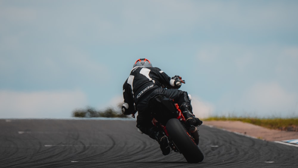 a person riding a motorcycle on a race track