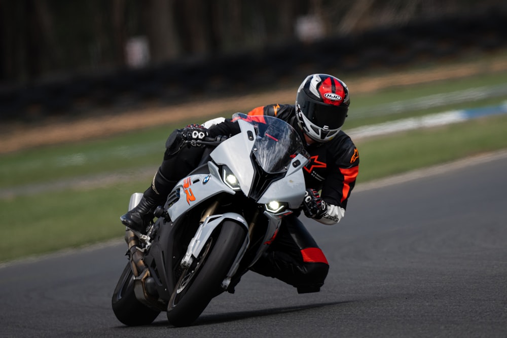 a person riding a motorcycle on a race track