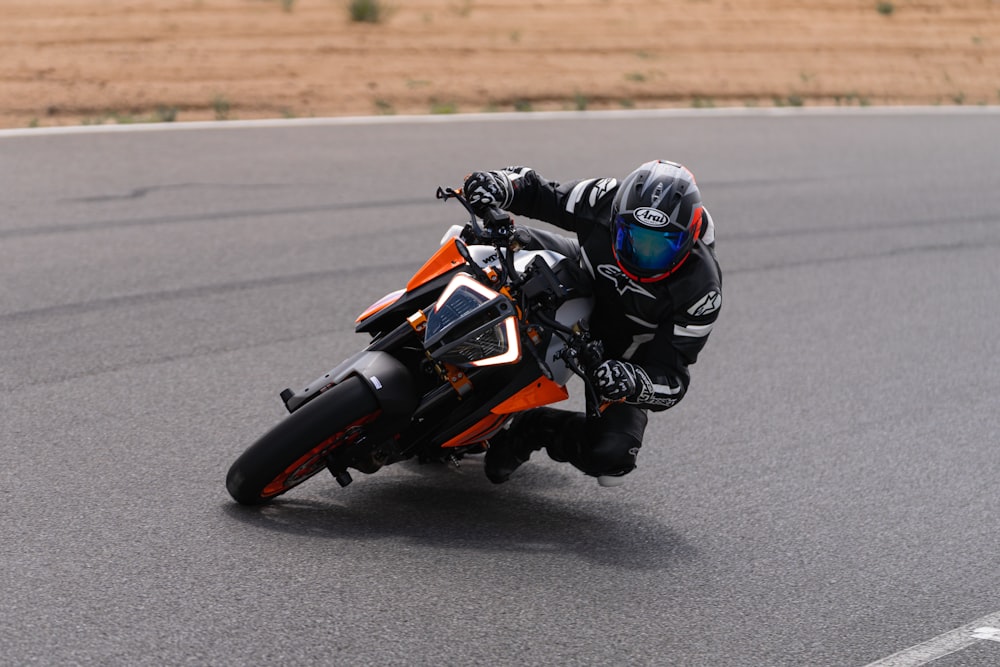 a person riding a motorcycle on a race track