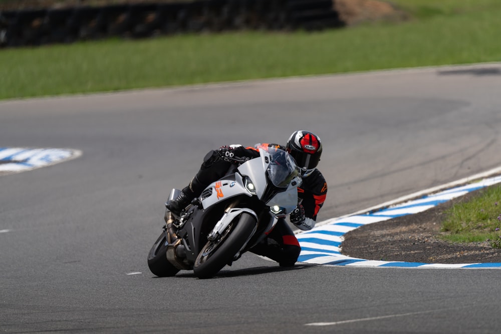 a person riding a motorcycle on a race track