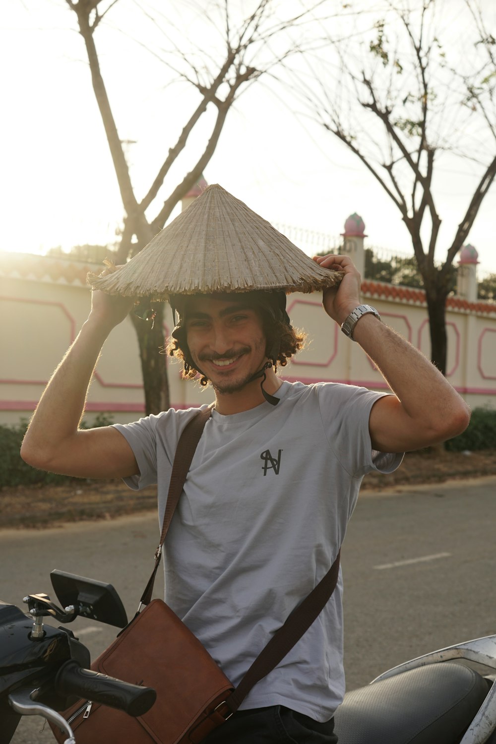 a man with a straw hat on top of his head