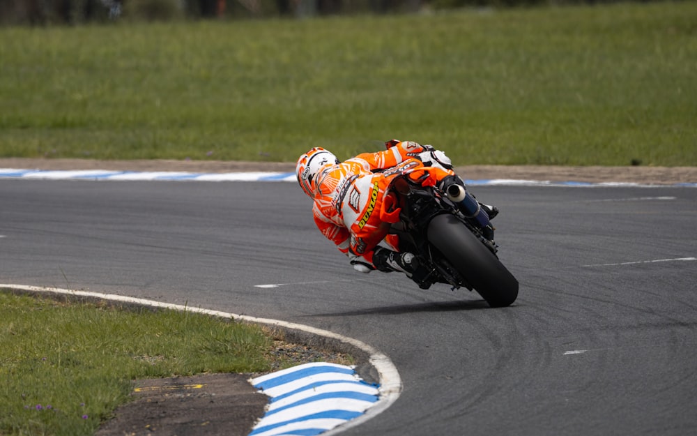 a person riding a motorcycle on a race track