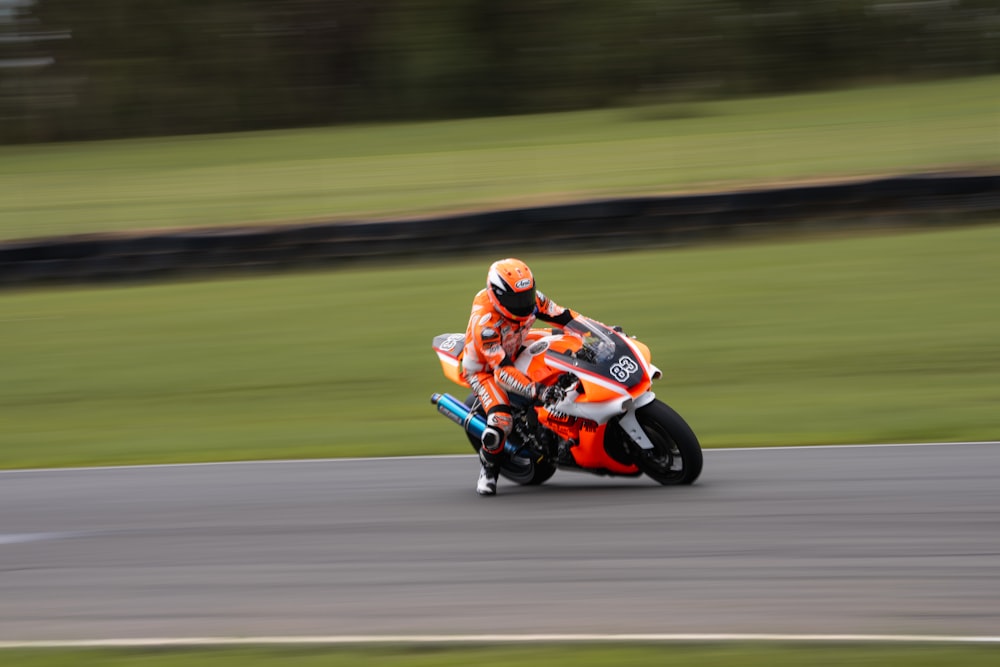 a person riding a motorcycle on a race track