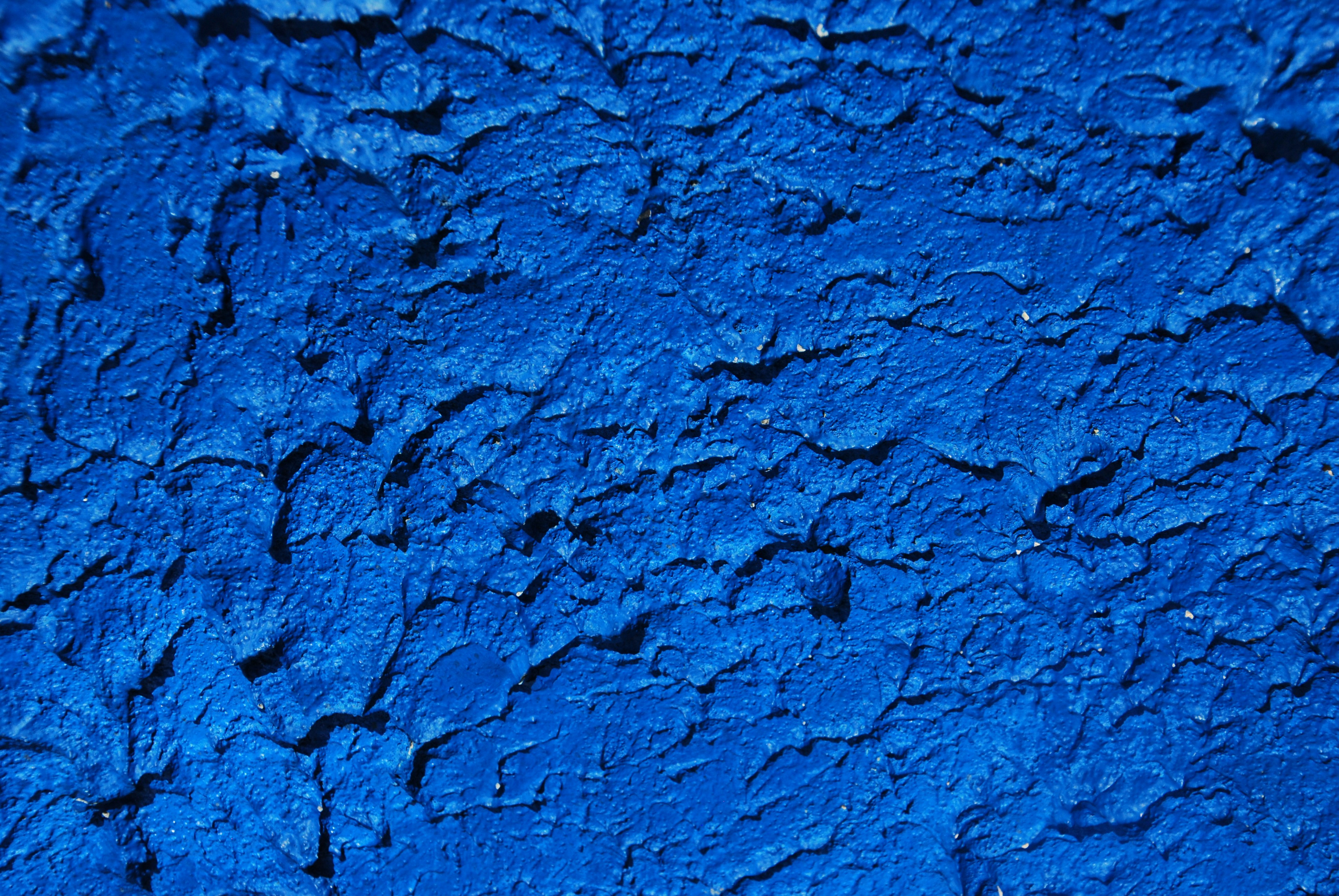 a close up of a blue painted wall