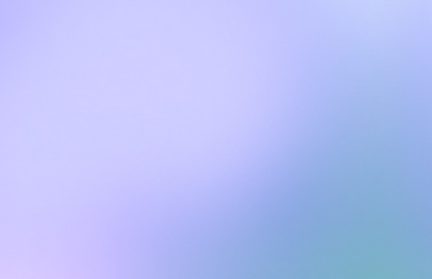 Close-up of a calming lavender and teal gradient background with subtle light bokeh.
