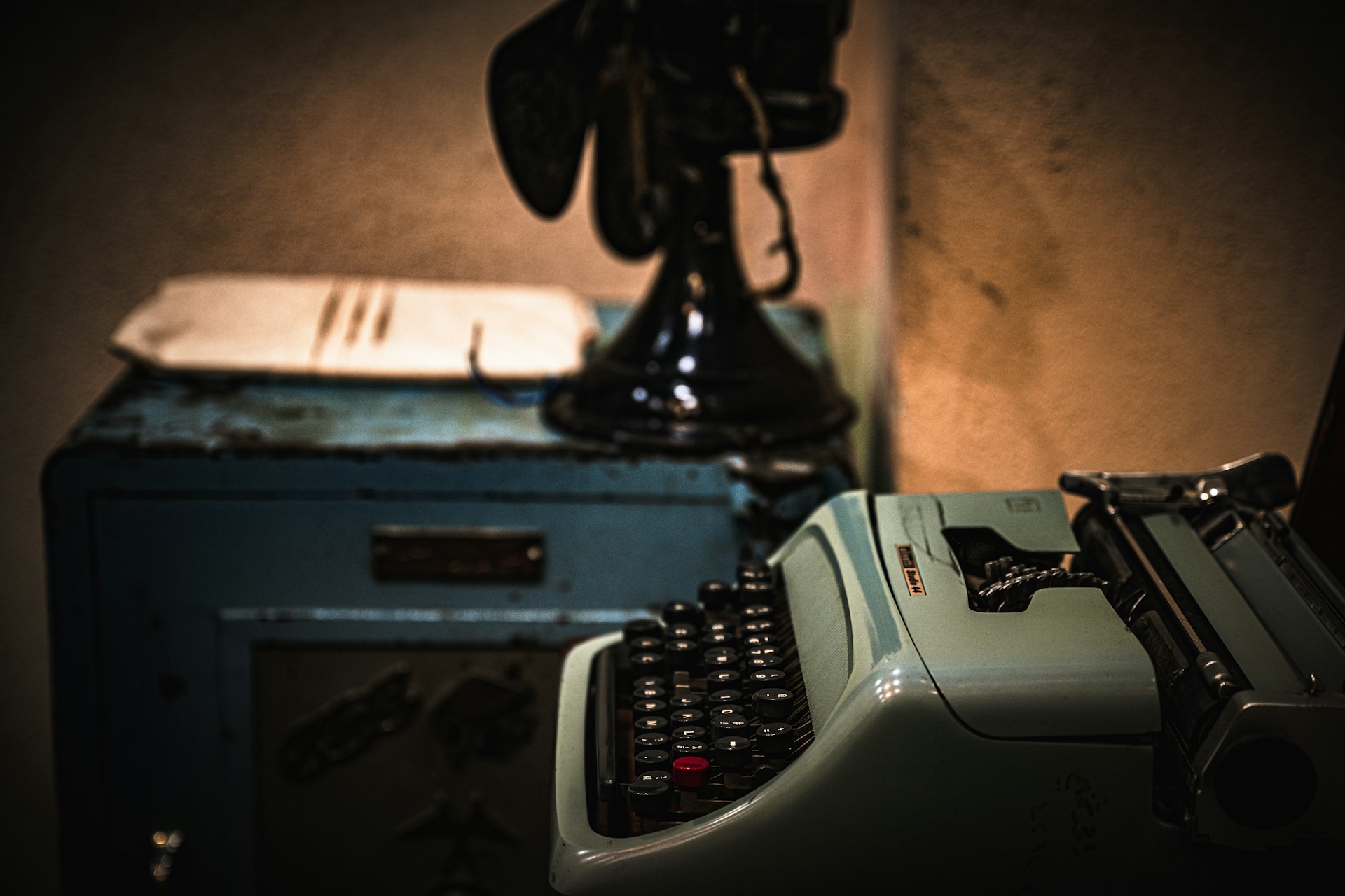 A moody, atmospheric photo of a vintage typewriter with a half-finished speculative fiction manuscript on the paper.