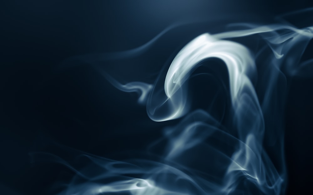 a blurry photo of smoke on a black background