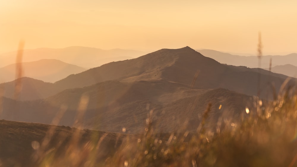 a view of a mountain range at sunset