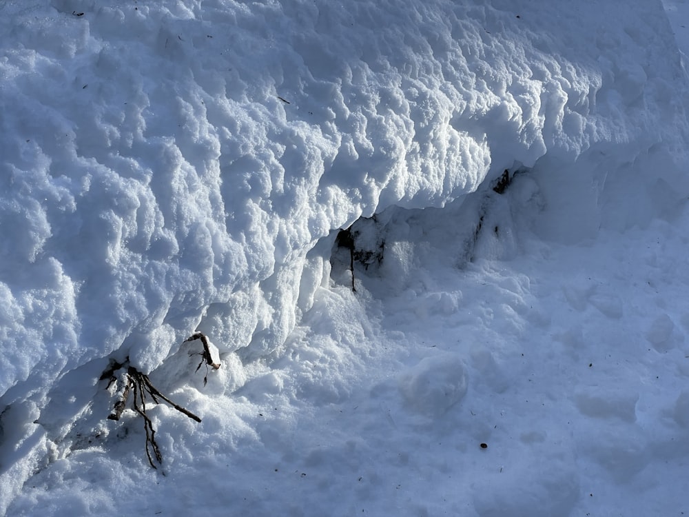 the snow is piled up on the side of the hill